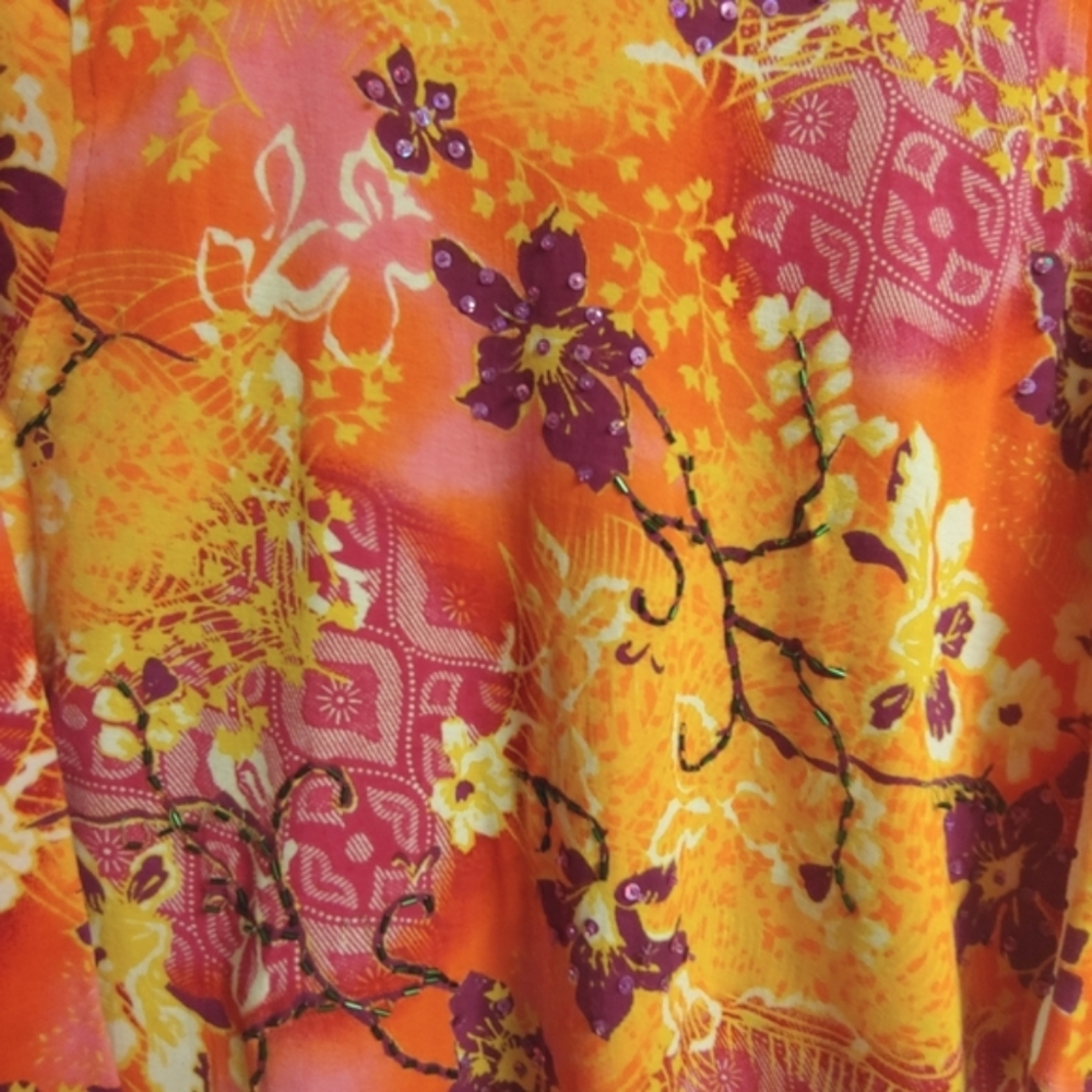 Beaded floral blouse.